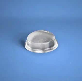 Clear domed framed cabinet bumper, part I-1163, on a blue background