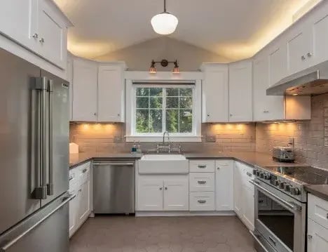 Renovated kitchen with white Shaker cabinet doors