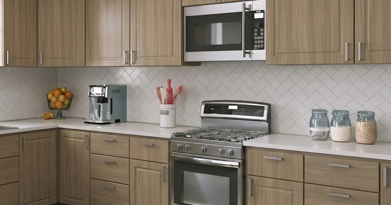 Kitchen with DuraFuse Shaker Beveled cabinet doors in Drift Elm