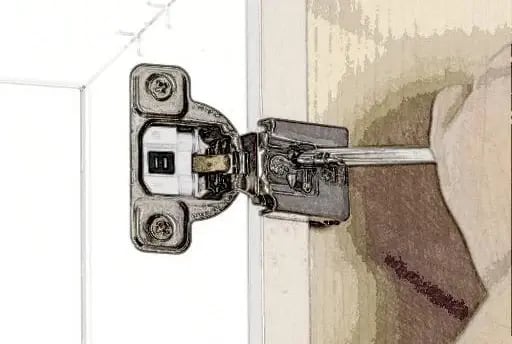 Hinge screwed to the face frame of a framed cabinet