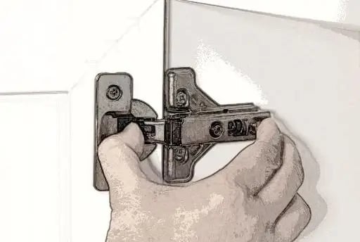 Clipping a cabinet hinge onto the mounted hinge plate