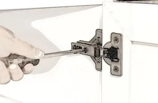 Adjusting a frameless cabinet hinge with a screwdriver